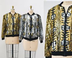 "Stunning gold sequin jacket features: * Black woven jacket fully embellished with gold black and silver sequins  * front zip closure  * fully lined  * Such a stunning jacket and ready to turn heads!! Even more beautiful in real life!!  Brand Jewel Queen Size Large fits closer to a medium * great vintage condition  Across shoulder 17\" Bust 46\" Body length from Shoulder seam 24\"  Sleeve length 33\" from center back All measurements are given in full. Thank you for visiting Hooked On Honey, and remember you can never look too fabulous!! Go Green! SILVER JACKET SOLD SEPARATELY, Thanks for looking! Visit the shop  https://www.etsy.com/shop/Hookedonhoney ** twitter | hookedonhoney ** pinterest | hookedonhoney ** Instagram | hookedonhoneyvintage" Gold Sequined Outerwear For Winter, Gold Sequined Long Sleeve Outerwear, Gold Long Sleeve Outerwear For Party Season, Gold Sequined Outerwear For Spring, Gold Outerwear For Party Season Night Out, Gold Outerwear For Night Out And Party Season, Gold Outerwear For Party Season And Night Out, Embellished Gold Outerwear For Spring, Spring Embellished Gold Outerwear