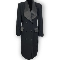 Beautiful black trench blazer. This piece can be worn as a blazer or a dress. Definitely up to you as it is midi length and buttons down. This can also be left open and worn as a duster is in immaculate condition. Great vintage piece! Does have functional pockets in the front.  Please refer to all photos and measurements below before ordering. As in the photos, there is some fading of the black lining. This does not affect the outside at all. Measurements approximately and unstretched (measurements taken flat aka side to side or up and down):         Brand:  Lynn Greene For Richard Neal Size: Tagged 10 Material: 100% wool Lining is 100%  acetate Made in Columbia Dry clean only Shoulder width: 17 inches P197it to pit: 18.5 inches Sleeve length: 24 inches Length: 44 inches Hip flat: 20 inche Spring Formal Jacket Dress With Button Closure, Formal Fitted Button-up Blazer Dress, Tailored Knee-length Blazer With Buttons, Fitted Button-up Blazer Dress For Formal Events, Black Buttoned Blazer Dress For Office, Black Double-breasted Blazer Dress With Buttons, Double-breasted Blazer Dress With Buttons For Evening, Double-breasted Blazer Dress For Evening, Classic Blazer Dress With Button Closure For Party