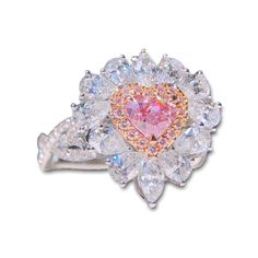 This diamond ring features GIA Certified Light Pink Diamond on the center. Pieces of round diamonds are set decoratively on the halo piece which is further set with marquises and pears in 18K white gold. Main Stone: Natural Diamonds Certified Carat Weight: 0.53 Shape Cut: Heart Brilliant Measurement: 4.65 x 5.25 x 2.97 mm Color: Fancy Pinkish Purple Clarity: I1 Cut: Excellent Polish: Very Good Symmetry: Good Fluoresce: None Side Stone: Natural Diamonds Carat Weight: 1.756 Metal Type: 18K White G Exquisite Pear-shaped Diamond Ring With Halo Setting, Pinkish Purple, Purple Diamond, Center Pieces, Halo Diamond Ring, Cute Rings, Diamond Halo, Pink Diamond, Brilliant Diamond