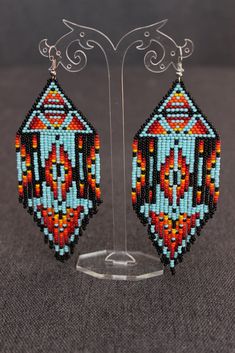 "These earrings are made of Czech beads. The lenth of the earrings is approx. 5.5\", width 2.4\" The thread used is synthetic and very strong. Please ask if you have any questions. Shipping to the USA may take to 30 days (but usually it is about 10-15 days)" Southwestern Beaded Dangle Earrings, Southwestern Style Beaded Dangle Earrings, Southwestern Style Round Bead Earrings For Festivals, Southwestern Style Earrings With Round Beads For Festivals, Southwestern Style Beaded Drop Earrings, Southwestern Beaded Drop Earrings For Pierced Ears, Southwestern Style Earrings With Dangling Round Beads, Traditional Beaded Earrings With Round Beads, Dangle Beaded Earrings For Festivals With Ear Wire