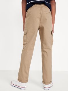 Elasticized waistband, with adjustable drawstring.  Diagonal pockets.  Adhesive secure flap cargo pockets at each leg.  Tapered rolled-cuff leg openings.  Soft, breathable quick-drying cotton/nylon twill.  Easy pull-on style.  Sits at waist.  Relaxed through hip and thigh.  Tapered leg.  Boys pull-on tech chino pants hit below ankle.  Models are approximately 4’3” – 4’8” and are wearing size M (numeric size 8). machine wash according to the care instruction label Utility Full Length Cargo Pants With Elastic Waistband, Full Length Utility Cargo Pants With Elastic Waistband, Khaki Utility Cargo Jeans With Elastic Waistband, Relaxed Fit Cargo Jeans With Elastic Waistband For Outdoor, Straight Leg Cargo Pants With Elastic Waistband For Outdoor, Outdoor Cotton Bottoms With Flap Pockets, Cargo Jeans With Pockets For Outdoor Activities, Casual Bottoms With Flap Pockets For Outdoor, Adjustable Waist Cotton Pants With Pockets