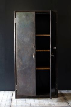 an open metal cabinet with two shelves on each side