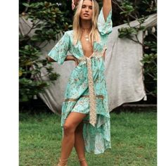 Floral Print Cut Out Plunging Neckline Maxi Dress Pre-Order Flowy Midi Dress For Spring Beach Cover-up, Green V-neck Beachy Maxi Dress, V-neck Floral Print Beach Dress For Brunch, Floral Print V-neck Dress For Beach Party, Green V-neck Beach Dress, Beachy V-neck Maxi Dress For Day Out, Beach Season V-neck Midi Dress, Green V-neck Midi Dress For Beach, Chic V-neck Dress For Beach Party