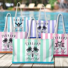 three beach bags sitting next to a pool