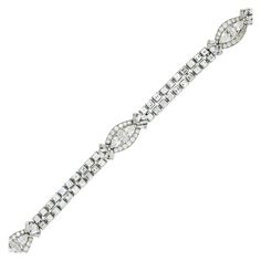 Oscar Heyman Brothers Diamond Bracelet | From a unique collection of vintage link bracelets at https://www.1stdibs.com/jewelry/bracelets/link-bracelets/ Elegant Platinum Bracelet With Baguette Diamonds, Elegant Platinum Diamond Bracelet With Baguette Diamonds, Elegant Platinum Diamond Bracelet With Baguette Stones, Diamond White Platinum Bracelet With Baguette Diamonds, Platinum Diamond Bracelet With Baguette Diamonds In Diamond White, Diamond White Baguette Cut Platinum Bracelet, Formal Diamond White Baguette Cut Diamond Bracelet, Formal White Gold Diamond Bracelet With Baguette Diamonds, Platinum Diamond Bracelet With Brilliant And Baguette Cut