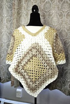 A unique one of a kind crochet poncho in neutral colors of white, beige, tan, taupe will complement any wardrobe.  Fashionable, functional, its unique design of coordinated neutral colors makes a great addition to your wardrobe.  Small to medium size, can be worn fall through to early spring, and even on those cool summer nights.  Made in a smoke free environment. Beige Crochet Poncho For Fall, Fall Crochet Beige Poncho, Beige One-size Crochet Top, One Size Beige Crochet Top, Ladies Poncho, Crochet Poncho, Cool Summer, Early Spring, White Beige