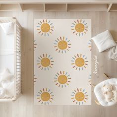 an overhead view of a baby's room with sun wallpaper