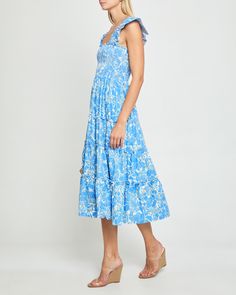 Price Comparison Few Moda $64 GANNI $255 Hill House $125 Product Details Adorable ruffled cap sleeves finish off the smocked bodice of this soft and breezy dress. Done with a tiered maxi skirt and side pockets. - Pockets- Square neckline- Maxi length- Content: 55% Linen, 45% Viscose Style# K21WDR10053 Fit Notes - Model wearing a size XS- Model measurements: 5'10.5'' Height / 32'' Bust / 25.5'' Waist / 34.5'' Hips- Garment measurements may vary due to the smocking bodice: Size Length Bust Waist X Flutter Sleeve Smocked Dress With Ruffles For Garden Party, Casual Tiered Mini Dress For Garden Party, Bohemian Dress With Smocked Bodice And Ruffled Straps, Blue Smocked Dress With Ruffles And Tiered Skirt, Flutter Sleeve Smocked Sundress With Ruffles, Tiered Smocked Dress With Ruffles For Beach, Sundress Smocked Dress With Flutter Sleeves And Ruffles, Smocked Tiered Skirt Dresses For Garden Party, Sundress With Flutter Sleeves And Ruffles