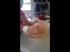 a woman is making food in the kitchen