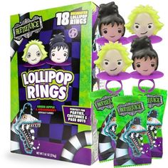 the lollipop rings are packaged in purple and green packaging, with three different designs on