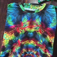 This Print Is So Bright And Graphic Casual Multicolor Print T-shirt, Casual Multicolor T-shirt With Colorful Pattern, Casual Multicolor Patterned T-shirt, Multicolor Patterned T-shirt For Summer, Casual T-shirt With Colorful Multicolor Print, Casual Multicolor Print T-shirt With Colorful Pattern, Casual Green Tops With Rainbow Print, Blue Short Sleeve Tops With Colorful Pattern, Vibrant Multicolor Crew Neck Top