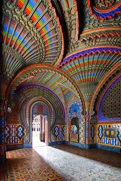 the inside of an ornate building with colorful walls and ceilings