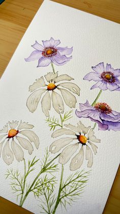 an image of flowers painted on white paper