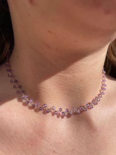 Discover the beauty of nature with this stunning Amethyst Faceted Crystal Bead Choker. The delicate purple amethyst beads catch the light, illuminating your neckline with a soft violet glow. Faceted 2mm amethyst beads strung on gold tone wire Fully adjustable from 36cm to 40cm Handmade choker style necklace to accent your neck. Let this gorgeous Amethyst Faceted Crystal Bead Choker add a pop of radiant colour to your outfit. The versatile 36cm to 40cm length can be worn high on the neck or lower Lavender Round Jewelry With Faceted Beads, Faceted Lavender Briolette Jewelry, Lavender Jewelry With Faceted Beads, Purple Amethyst Briolette Jewelry, Purple Briolette Amethyst Jewelry, Purple Faceted Crystal Necklaces For Gifts, Lavender Faceted Beads Jewelry For Gifts, Lavender Amethyst Necklaces For Jewelry Making, Lavender Jewelry With Faceted Beads For Gift