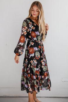 The Prepared To Impress Black Floral Midi Dress will have you more than ready to be the talk of any party! Crafted from a soft, breathable fabric, this dress features a classic black background adorned with vibrant floral patterns that pop beautifully, making it perfect for any season. The flattering midi length provides versatility, allowing you to dress it up for special occasions or keep it casual for everyday wear. With its fitted bodice and gently flared skirt, this dress accentuates your f Elegant Black Floral Maxi Dress, Black Floral Print Spring Dress, Black Floral Print Dress For Spring, Black Floral Dress For Spring, Spring Black Floral Dress, Elegant Black Floral Dress For Spring, Black Floral Print Maxi Dress For Spring, Black Floral Midi Dress For Spring, Black Floral Print V-neck Maxi Dress