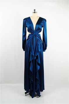 𝑫𝒆𝒔𝒄𝒓𝒊𝒑𝒕𝒊𝒐𝒏: Cut-out along a plunging buckled bodice, ruffles their floor-skimming gown in a silky Blue satin. Back tie and zip closure. ∙Model wearing size Small 𝑺𝒊𝒛𝒆 𝑪𝒉𝒂𝒓𝒕: • 2-4 Small • 6-8 Medium • 10-12 Large 𝑺𝒉𝒊𝒑𝒑𝒊𝒏𝒈 • This Item ships for free. 𝑹𝒆𝒕𝒖𝒓𝒏𝒔 • Returns (For store credit only) accepted within 30 days after your package has been delivered. 𝑪𝒂𝒏𝒄𝒆𝒍𝒍𝒂𝒕𝒊𝒐𝒏𝒔 • Can be canceled within 30 min. Satin Maxi Dress With V-neck And Ruffles, Satin Maxi Dress With Ruffles And V-neck, Satin V-neck Maxi Dress With Ruffles, Blue Silk Maxi Dress With Ruffles, Mykonos Blue, Satin Maxi, Satin Maxi Dress, Blue Satin, Mykonos