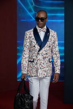 Take conversations to new heights in this refreshing one-of-a-kind tuxedo for men or women. Perfect for weddings or formal events in the spring and summer. FREE SHIPPING ON ORDERS OVER $199 COLOR White COMPOSITION N/A YARN COUNT N/A WEIGHT 275g FABRIC STYLE Paisley OCCASION Wedding/Gala Tuxedo For Men, Cuffed Pants, Suit Style, Double Breasted Suit, Straight Pants, Formal Event, Double Breasted, Paisley, Color White