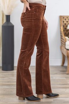 Product Details Wash/Color: Cognac Rise: Mid Rise Style: Corduroy Bootcut Material and Care: 97% Cotton 3% Spandex Machine Wash Cold Tumble Dry Low Size and Fit 24=0 Rise: 8.5" Inseam: 32" 25=1 Rise: 9" Inseam: 32" 26=3 Rise: 9" Inseam: 32" 27=5 Rise: 9" Inseam: 32" 28=7 Rise: 9.5" Inseam: 32" 29=9 Rise: 9.5" Inseam: 32" 30=11 Rise: 10" Inseam: 32" 31=13 Rise: 10.5" Inseam: 32" 32=15 Rise: 10.5" Inseam: 32" Photo model is 5'7 and wearing a size 25 Photo model is 5'7 and wearing a size 27 Video m Corduroy Bootcut Pants, Corduroy Pants Outfit, Corduroy Leggings, Bootcut Pants, Photo Model, Swimsuit Shops, Shopping Sites, Long Sleeve Cardigan, Long Sleeve Maxi Dress