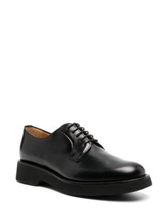 Church's Shannon Leather Derby Shoes - Farfetch Classic Lace-up Shoes With Calf Leather And Round Toe, Timeless Lace-up Shoes With Rubber Sole For Office, Business Dress Shoes With Lug Sole And Round Toe, Black Calf Leather Plain Toe Oxfords, Low-top Oxfords With Stitched Sole For Workwear, Business Lace-up Shoes With Lug Sole, Elegant Lace-up Shoes With Lug Sole For Work, Black Calf Leather Oxfords For Derby, Business Wingtip Dress Shoes With Lug Sole