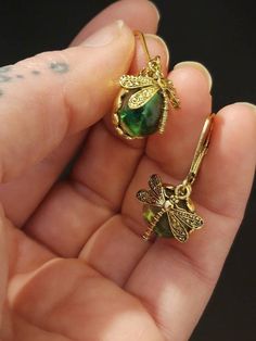 Check out this item in my Etsy shop https://www.etsy.com/listing/1059874489/dragonfly-sun-catcher-earrings Elegant Hypoallergenic Dragonfly Earrings, Green Hypoallergenic Jewelry Gift, Hypoallergenic Green Jewelry Gift, Green Spiritual Earrings For Gift, Spiritual Green Earrings For Gift, Nickel-free Adjustable Dragonfly Jewelry, Green Metal Earrings For Gift, Nickel-free Gold Dragonfly Jewelry, Handmade Gold Dragonfly Jewelry