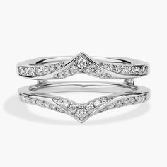 two white gold wedding rings with diamonds