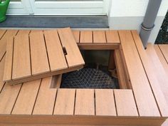 a wooden deck with a hole in it