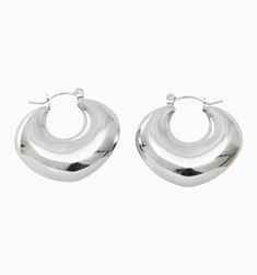 Meet these gorgeous hoop earrings. They're not just lightweight, tarnish-resistant, and waterproof, but also super chic! The puffy design gives them a modern and sleek look, perfect for any occasion. Modern Metal Hoop Huggie Earrings, Modern Small Hoop Metal Huggie Earrings, Modern Metal Small Hoop Huggie Earrings, Chic Silver Hoop Earrings Tarnish Resistant, Trendy Metal Huggie Earrings, Modern Metal Huggie Earrings, Modern Round Huggie Earrings, Modern Round Metal Huggie Earrings, Chic Nickel-free Hoop Earrings