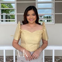 Add a touch of modern flair to your traditional Filipino style with our Crop Top Filipiniana design! This trendy crop top features a sweetheart neckline, delicate Mestiza sleeves, and a zipper back for easy on-and-off. The vibrant yellow shade is perfect for making a statement at any Filipiniana-themed event or occasion. The modern cut and cropped silhouette make it perfect for pairing with high-waisted pants or a flowy skirt for a chic and stylish look. Get ready to shine in this stunning piece Filipiniana Crop Top, Filipiniana Design, Shade Of Yellow, Trendy Crop Top, Filipino Style, Trendy Crop Tops, Cropped Tops, Flowy Skirt, Shades Of Yellow