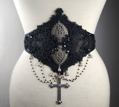 Gothic waist belt with beaded lace. Decorated with metallic drops, cross and delicate Swarovski chains. Adjustable with elastic band and metallic regulators. Light boned with syntethic whalebones. Can be worn alone, on jackets or on corsets, as you wish! ------------------------------------------------------------- Facebook: https://www.facebook.com/nocturnalgarden Instagram: https://www.instagram.com/nocturnalgardenatelier ------------------------------------------------------------- credits fo Lace Decorations, Velvet Corset, Victorian Goth, Lace Decor, Goth Outfits, Suspender Belt, Beaded Lace, Corsets, Goth Fashion