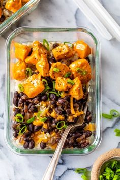 two glass dishes filled with black beans and tofu