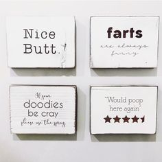 four square wooden plaques with different sayings on them