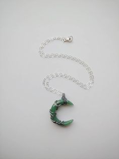 "This beautiful crescent moon shaped Green Aventurine stone is wrapped inside Sterling silver wire. Liver of sulphur has been used to give the silver an antique look, and it's sealed with Renaissance Wax to avoid tarnishing. The necklace has been made at 18\" on a Sterling silver chain, but length can be adjusted to fit your personal taste. The pendant hangs 1.5\" from chain. Finished with a lobster clasp. All my jewelry is handmade, and made with patience, care and love. In the unlikely event t Green Crescent Moon Charm Jewelry, Spiritual Crescent Wire Wrapped Necklaces, Handmade Green Crescent Jewelry, Black Obsidian Ring, Green Aventurine Necklace, Green Aventurine Stone, Obsidian Ring, Aventurine Necklace, Raw Quartz Crystal