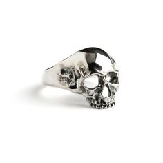 Beautifully detailed skull ring hand made out of sterling silver. Although the morbidity of skulls they are also symbolise rebirth, renewal, and spiritual awakening. Material: 925 Sterling Silver Sizes: US 6-9 Length: approx 22mm Silver jewellery can be clean with a phosphate-free detergent or a non abrasive cloth made for cleaning jewellery. All of our jewellery packed in our labeled gift box For more of our rings, click here: https://www.etsy.com/uk/shop/Tribulondon?ref=simple-shop-header-name Grunge Ring, Goth Ring, Sterling Silver Skull Rings, Chunky Silver Rings, Grunge Jewelry, Edgy Jewelry, Silver Skull Ring, Packing Jewelry, Gothic Rings