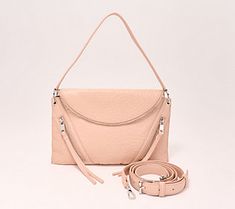 Effortlessly fashionable, this leather crossbody exudes edgy appeal with two asymmetrical front pockets and enhanced interior organization. From Vince Camuto. Spring Leather Bag With Zipper Pocket, Leather Bag With Zipper Pocket For Spring, Interior Organization, Fashion Handbags, Vince Camuto, Leather Crossbody, Handbags, Leather