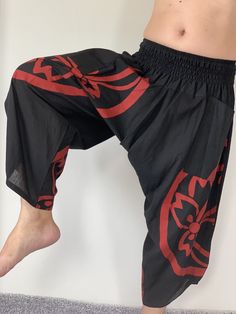 "Samurai Pants, elastic waist Samurai Pants Unisex Elastic Waist, ninja pants Samurai Pants (Unisex) Elastic Waist MATERIAL: 100% Cotton APPROX MEASUREMENT: Elastic Waist :24\"- 40\" Length :34\" Hip up to :52\" Around Ankle: 18 inch Pockets: x 2 Material : Cotton ♥ PAYMENT We accept payments via PayPal only. ♥ Shipping : - All items will be shipped within 1 business day after received payment. We ship items via DHL Express. ♥ Delivery Time : USA only 2 business days Canada: 2- 3 business days F Stretch Black Harem Pants For Festivals, Black Harem Yoga Pants With Elastic Waistband, Traditional Black Harem Pants For Yoga, Black Cotton Harem Yoga Pants, Black Cotton Harem Pants For Yoga, Black Harem Pants With Elastic Waistband For Festivals, Black Harem Yoga Pants, Baggy Black Harem Pants For Festival, Traditional Black Harem Pants For Festival