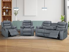 two recliners and a chair in a room