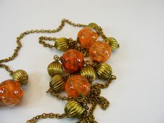 Italian Necklace, Necklace, Murano, One Strands, Orange, Grass beads, Venetian Murano, Vintage Necklace,  Italy, Necklace, Long Necklace, Women Necklace, Gift for her --------------------------- Beautiful Vintage Italian Venetian Murano Art Glass Necklace. Lovely combination of orange Venetian murano glass beads and brass beads. This 45.27" (115cm) long necklace. Glass beads 0.58" (1.5cm) diameter. Made in 1950. In good vintage conditions. Please see photos for more details.   For adult use only Retro Necklace With Large Beads For Gift, Vintage Beaded Chain Necklace With Round Beads, Vintage Beaded Chain Beads As Gift, Unique Orange Beaded Necklaces, Unique Orange Necklaces With Round Beads, Unique Orange Round Bead Necklaces, Vintage Orange Jewelry With Faceted Beads, Vintage Long Glass Necklace, Vintage Glass Beaded Necklaces For Jewelry Making