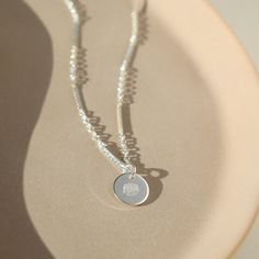 Our Birth Flower Necklace makes a sweet and sentimental gift for any mom or grandma. Crafted with a round disc that is hand-stamped with the flower associated with the month of the child's birth, it is a beautiful and meaningful symbol of the special bond between mother and child. DETAILS14k gold fill or sterling silver14", 16", 18" or 20" lengthsThe charm measures 3/8" Hypoallergenic, Nickel Free and Water Safe Engraved Jewelry As Gift For Mom, Engraved Round Disc Jewelry Gift For Mom, Everyday Birth Flower Charm Necklaces, Everyday Birth Flower Charm Necklace, Everyday Charm Necklace With Birth Flower Round Pendant, Everyday Round Pendant Charm Necklace With Birth Flower, Engraved Round Disc Necklace As Gift For Mom, Birth Flower Charm Necklace, Minimalist Round Charm Necklace With Flower Charm