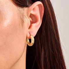 Add a bold twist to your style with our Bold Twist Hoop Earrings.These stunning earrings feature an eye-catching twisted design that sets them apart from classic hoops. These hoops are both durable and lightweight, ensuring comfort for all-day wear. Perfect for making a statement at special events or adding a touch of flair to your everyday look. - Made in 14k solid gold - Earring Width: 4.86 mm / 0.19 inches - Thickness: 4.74 mm / 0.18 inches - Length: 20.25 mm / 0.80 inches - This product comes with iconic Norm Jewels gift box Modern Twist Hoop Earrings For Everyday Wear, Hypoallergenic Hoop Earrings With A Modern Twist, Modern Twist Hypoallergenic Hoop Earrings, Modern Twist Tarnish Resistant Huggie Earrings, Twisted Yellow Gold Earrings, Real Gold Hoop Earrings, Twist Hoop Earrings, Solid Gold Earrings, Earrings In Gold