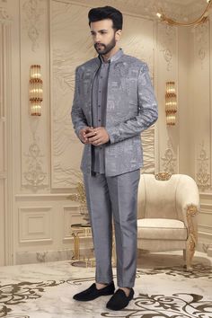 This elegant short sherwani is a luxurious addition to any gentleman's wardrobe. With a beautifully crafted thread embroidery open jacket, this mens sherwani exudes sophistication and exclusivity. Perfect for special occasions and formal events, it is the epitome of refined style. Elevate your look with this M42-S117 sherwani. Elegant Gray Sets With Zari Work, Elegant Gray Kurta For Eid, Elegant Gray Kurta With Resham Embroidery, Fitted Nehru Jacket For Groom In Transitional Season, Semi-formal Party Wear Sherwani For Festive Occasions, Semi-formal Festive Party Wear Sherwani, Festive Semi-formal Party Wear Sherwani, Elegant Gray Designer Wear Sets, Elegant Gray Festive Traditional Wear