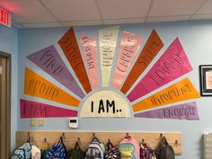 Large Boho sun hung on the wall with “I am” at the center. Rays with affirmations come out from the center. Kindness Wall Classroom, Blank Wall In Classroom Ideas, El Classroom Decor, Texas Rising Star Classroom Set Up, Affirmation Wall Classroom, Elementary Classroom Wall Decor, Elementary Hallway Decor, Study Hall Classroom Decor, Counseling Classroom Decor