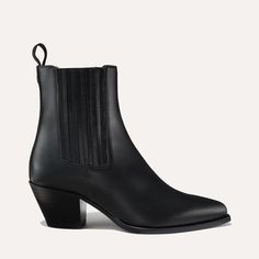 Open-air style meets downtown cool. With subtle nods to Western styles—from its squared-off welt to its angular heel—this boot makes every look feel adventurous. Western Chelsea Boots With Reinforced Heel In Calf Leather, Classic Snip Toe Boots With Branded Heel Counter, Classic Boots With Branded Heel Counter And Snip Toe, Western Boots With Sculpted Heel For Fall, Western Calf Leather Boots With Stacked Heel, Western Chelsea Boots With Square Toe And Reinforced Heel, Western Style Calf Leather Boots With Stacked Heel, Classic Square Toe Boots With Branded Heel, Luxury Boots With Reinforced Heel For Fall