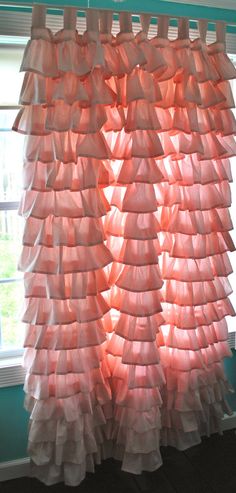 a curtain made out of plastic bags in front of a window