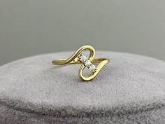 Slanted Three Stone Infinity Ring If you want to gift yourself or someone you love a different ring, this ring is exactly what you're looking for.  You can choose it as a promise, engagement or proposal ring. When you receive the infinity gold ring, please share a photo of it with me! PRODUCT INFORMATION DETAİLS *Metal Type: Solid 8K/14K/18K (White/Yellow/Rose) Gold *Center Gemstone: 1.30 mm *Ring Weight: 1.90 Gram  GIFT  ❥ Your product will be sent in a nice high quality jewelry box. ❥ If you have a gift note at the time of purchase, I will be happy to write it on the card. ❥ And there is more than that! I will also send you a gift, a silver jewelry, which is handmade in my atelier. Oh, this would be a surprise!               RETURN POLICY ❥ Item will be produced according to the color an Modern Bypass Ring With Round Cut For Gift, Modern Twist Rings With Diamond Accents For Gift, Modern Twist Rings With Diamond Accents As Gift, Modern Twist White Gold Diamond Ring As Gift, Diamond Bypass Ring With Single Cut Diamonds As Gift, Elegant Bypass Ring With Single Cut Diamonds Gift, Fine Jewelry Bypass Ring With Tension Setting For Gift, Gift Diamond Ring With Modern Twist, Diamond Ring With Modern Twist For Gifts