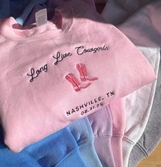 Custom Bridesmaid Cowgirl Embroidered Sweatshirt Embroidered on 50/50 cotton/polyester blend sweatshirts.  Need something custom? Need it by a certian date? We'd love to help! Please send us a message BEFORE placing your order. 📜 RETURN POLICY:WE DO NOT ACCEPT RETURNS OR EXCHANGES. Please consider this before purchasing. For more details, please read our shop policies.  👕 SIZING: *Sweaters are UNISEX fit. Sweatshirts fit true to size. Some garments are pre-shrunk but may shrink slightly after washing. For a more fitted look, we suggest your usual size. For a more relaxed fit, we recommend sizing up. Please refer to size charts in listing photos for details. 💡Measuring tip: Take your favorite sweater, lay it on a flat surface and measure the length (top to bottom) and width (armpit to ar Pink Cotton Top With Machine Embroidery, Pink Crew Neck Sweatshirt With Machine Embroidery, Fitted Long Sleeve Top With Custom Embroidery, Pink Long Sleeve Sweatshirt With Embroidery, Pink Long Sleeve Sweatshirt With Machine Embroidery, Pink Cotton Sweatshirt With Machine Embroidery, Pink Winter Tops With Custom Embroidery, Pink Custom Embroidered Tops For Fall, Pink Tops With Custom Embroidery For Fall