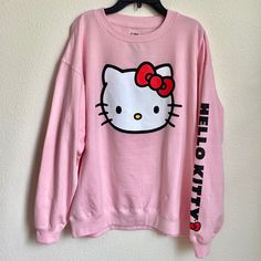 Sanrio Hello Kitty Pink Sweatshirt With Printed Design Brand New Without Tags. Never Worn. Size: Large Lightweight Sweatshirt With Printed Designs. Ribbing At Neckline, Cuffs, And Hem. Soft, Brushed Inside. Cotton 60%, Polyester 40% Machine Wash. Imported. L: Chest (Armpit To Armpit):24” Length (From Top Back Neck Seam To Hem): 27.5” Kawaii Hello Kitty Print Crew Neck Top, Cute Character Print Tops For Loungewear, Cute Tops With Character Print For Loungewear, Hello Kitty Cotton Sweatshirt In Kawaii Style, Hello Kitty Long Sleeve Cotton Top, Cute Hello Kitty Print Crew Neck Sweatshirt, Hello Kitty Print Top For Winter Streetwear, Kawaii Long Sleeve Top With Hello Kitty Print, Cute Cotton Sweatshirt With Hello Kitty Print