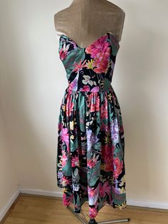 A vintage 1980's cotton Berkertex Occasions strapless tropical print dress with a sweetheart boned bodice. There is matching jacket to this dress available to buy in the shop also. UK Size 10. Please check measurements: Chest - 88cm Waist - 70cm Length - 93cm from top of the chest Tropical Print Strapless Dress, Strapless Tropical Print Dress, Strapless Tropical Print Summer Dress, Multicolor Tropical Strapless Dress, Tropical Multicolor Strapless Dress, Vintage Tropical Print Dresses For Spring, Vintage Dresses With Tropical Print For Spring, Retro Summer Dresses With Tropical Print, Summer Retro Dresses With Tropical Print