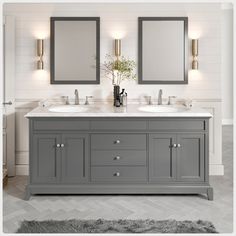 a bathroom vanity with two mirrors above it