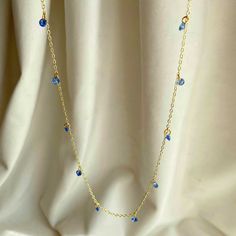 With its barely there presence and sophisticated minimalism, this Rising Star Naked sapphire necklace is a modern alternative to the traditional station necklace.  The 10 shimmering round blue sapphires hang from the gold chain creating a necklace that moves with you.  Alone as an everyday piece or layered with your other favourites, it is most certainly a contemporary classic.  ----- Dimensions: 18inches, Mini Belcher Chain Sourcing: Recycled gold, here in Hatton Garden, London Diamonds: Blue Sapphire, Round Brilliant, 4mm 0. 25ct, lab grown Sophisticated Minimalism, Sapphire Diamond Necklace, Belcher Chain, Star Blue, June Birthstone Jewelry, Zodiac Jewelry, Contemporary Classic, Jewelry Ring Box, Pearl Jewellery Earrings