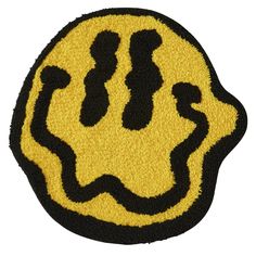 a yellow and black smiley face rug on a white background with the word happy written in it